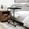 vidaXL Table d'appoint avec roues noir 55x35x70 cm bois d'ing&eacute;nierie