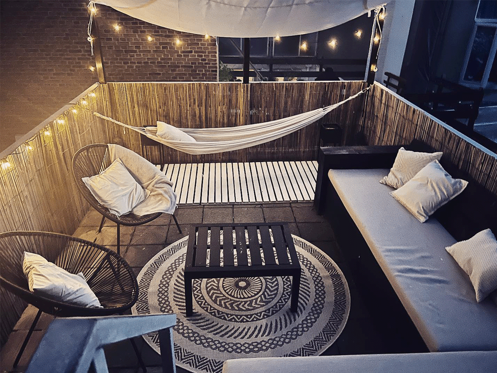 Rooftop lounge with string lights